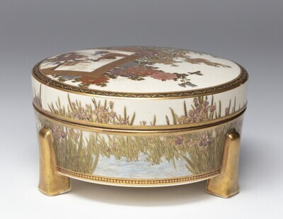 Covered box with various plants and flowers and children playing, Senzan 泉山 (dates unknown), Japan, 1850-1920, h. 7 x diam. 14 cm, stoneware with overglaze enamels and gilding, Groninger Museum (on loan from Anders Foundation), 2019.1228.